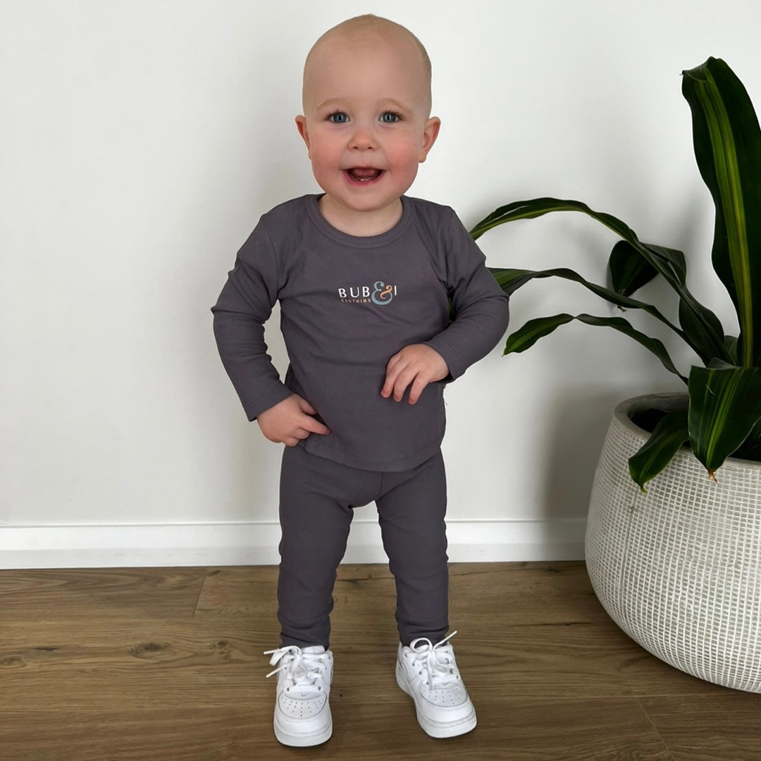 baby in full set top and pants