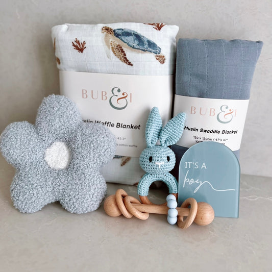 dummy holder, two blankets, two rattles milestone card